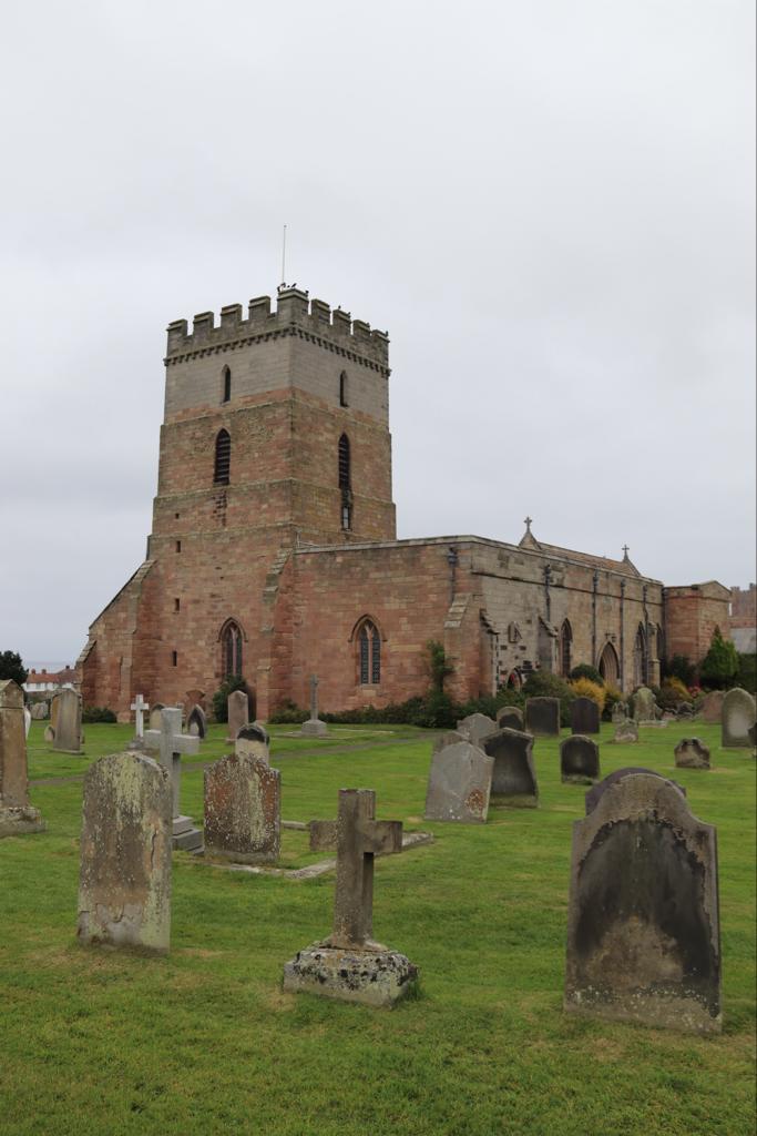 St Aidan's Church - A small parish church surrounded by weatered headstones in Bamburgh. 